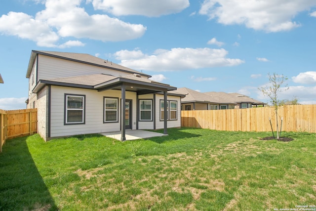 11583 Cottage Pt, San Antonio, TX 78254 - rear view of house with a yard, a fenced backyard, and a patio area