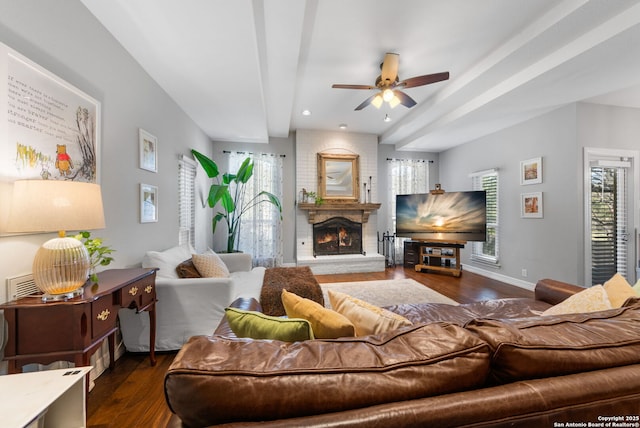 living room with a ceiling fan, wood finished floors, recessed lighting, a fireplace, and baseboards