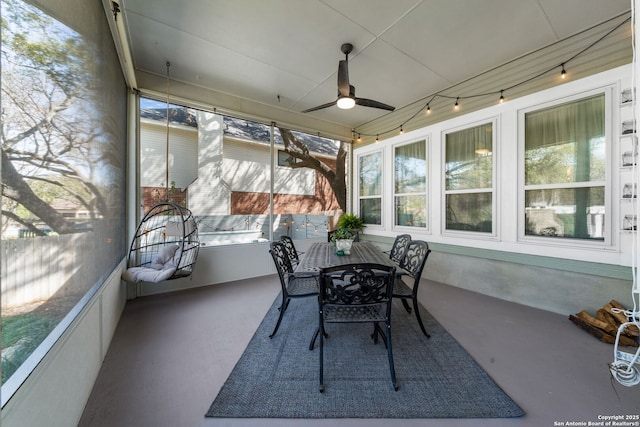 sunroom featuring ceiling fan