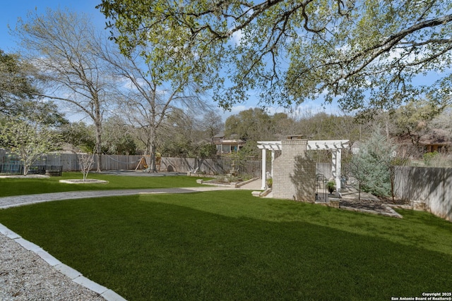 view of yard with a fenced backyard and a pergola