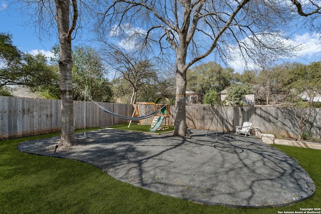 exterior space with a lawn and a fenced backyard