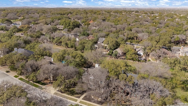 drone / aerial view featuring a view of trees