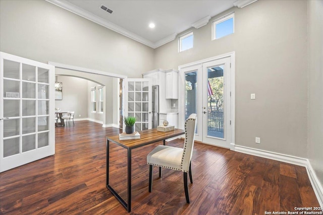 office area with visible vents, french doors, a high ceiling, arched walkways, and dark wood-style flooring