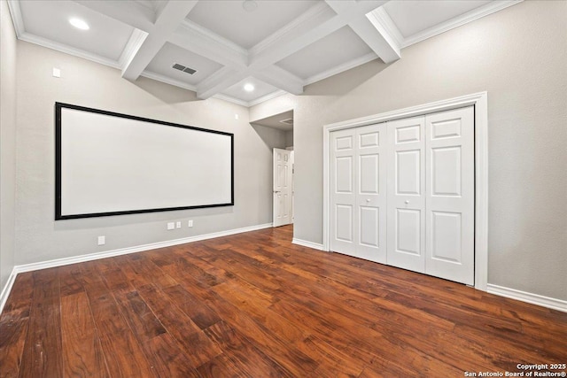 cinema featuring visible vents, baseboards, coffered ceiling, and hardwood / wood-style flooring