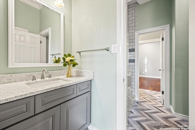 bathroom featuring vanity and wood finished floors