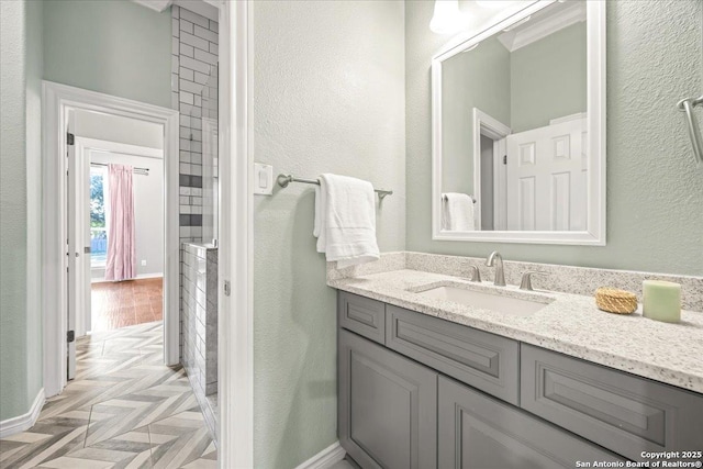 bathroom featuring vanity and baseboards