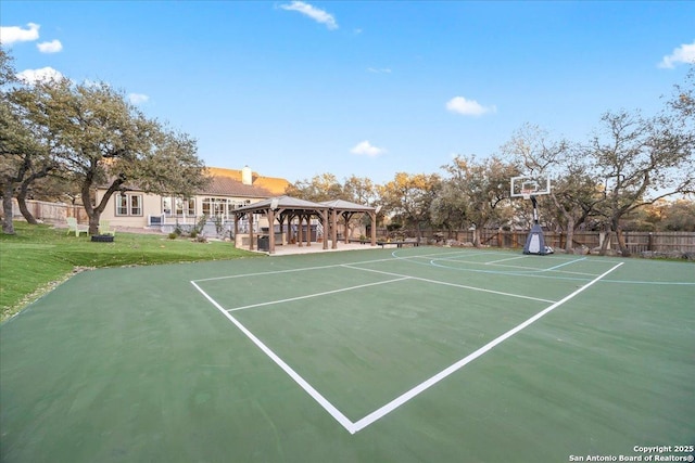 view of basketball court with a gazebo, community basketball court, a yard, and fence