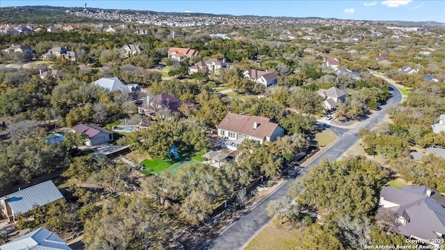 birds eye view of property with a residential view