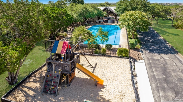 view of playground with a lawn