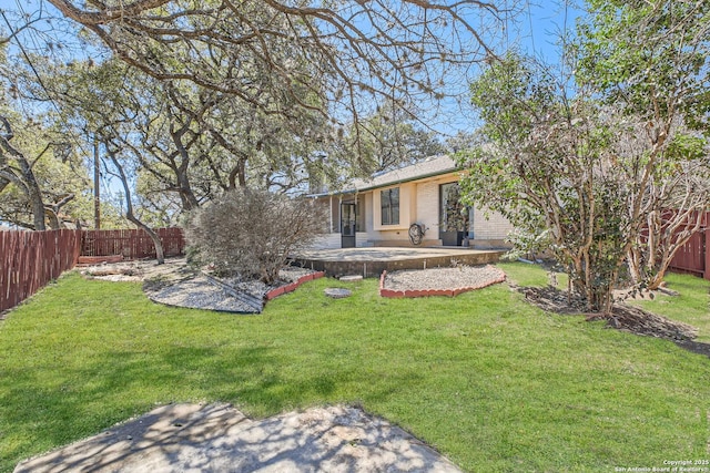 view of yard with a patio area and a fenced backyard