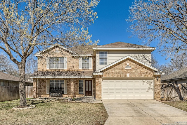 traditional-style house with brick siding, driveway, a garage, and fence