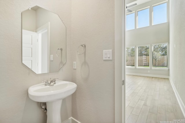 bathroom featuring baseboards and wood finished floors