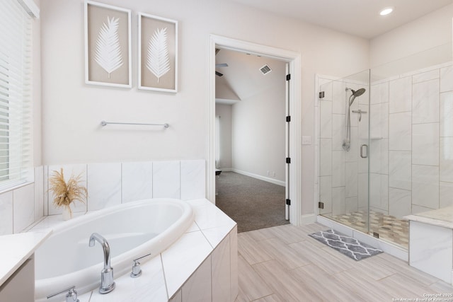 bathroom featuring visible vents, recessed lighting, a shower stall, baseboards, and a bath