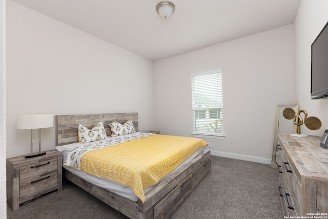 carpeted bedroom featuring baseboards