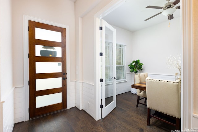 interior space with dark wood finished floors, wainscoting, and ceiling fan