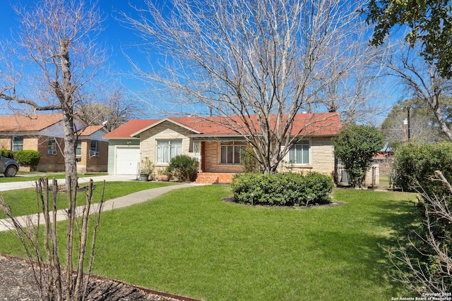 single story home with a garage, concrete driveway, and a front yard