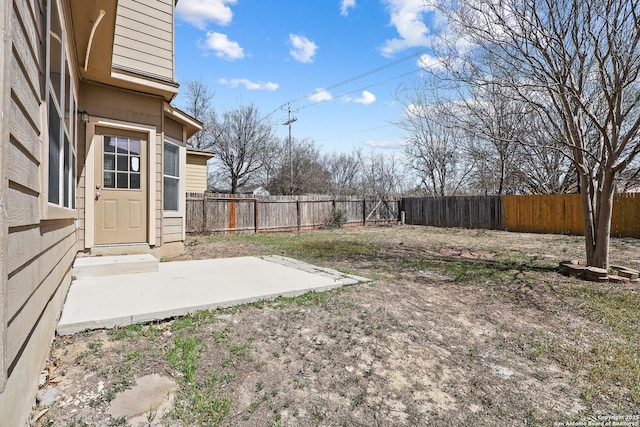 view of yard with a patio area and a fenced backyard