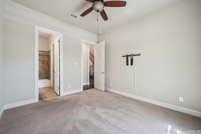 unfurnished bedroom with ensuite bath, baseboards, visible vents, and light carpet