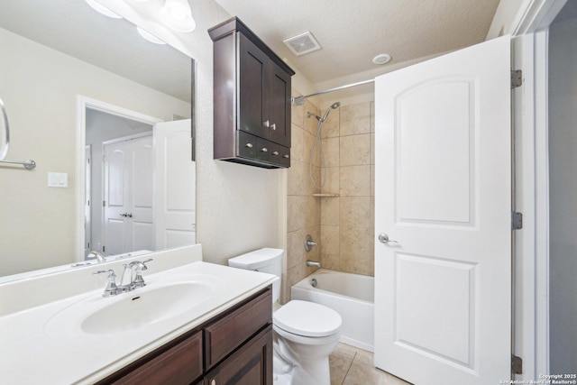 full bathroom with tile patterned floors, visible vents, toilet, washtub / shower combination, and vanity