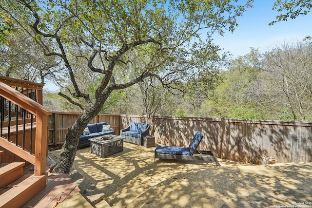 view of patio with outdoor lounge area and a fenced backyard