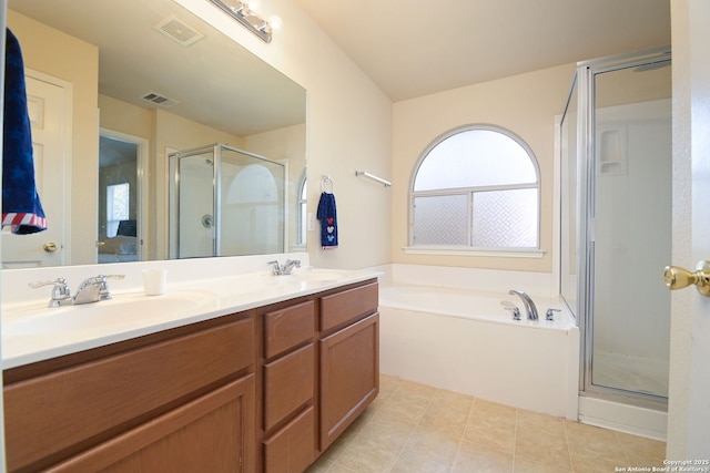 full bath with a sink, visible vents, a garden tub, and a shower stall