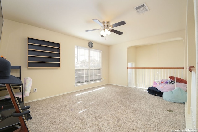 home office featuring visible vents, carpet floors, baseboards, and a ceiling fan