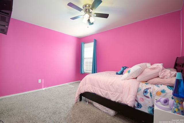 bedroom with a ceiling fan and carpet floors