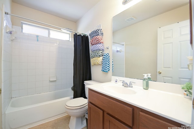 bathroom with visible vents, toilet, shower / bath combo with shower curtain, tile patterned floors, and vanity