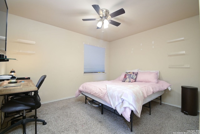 carpeted bedroom featuring baseboards and ceiling fan