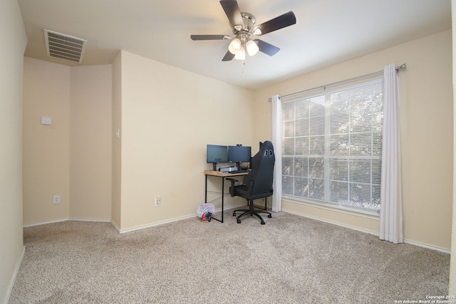 office area with a ceiling fan, carpet flooring, baseboards, and visible vents