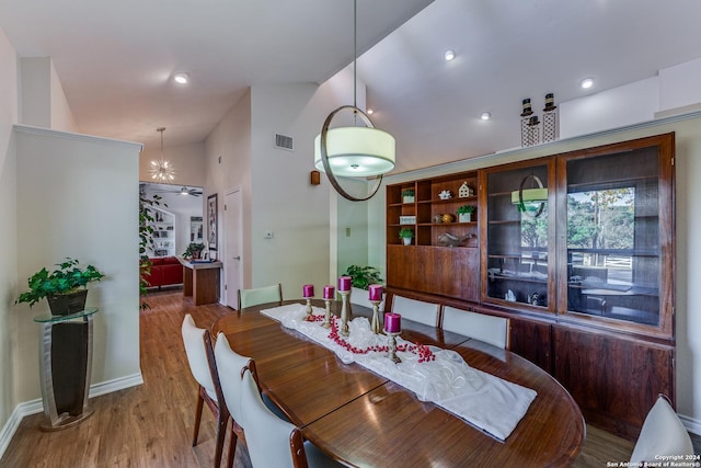 dining area featuring recessed lighting, wood finished floors, visible vents, and baseboards