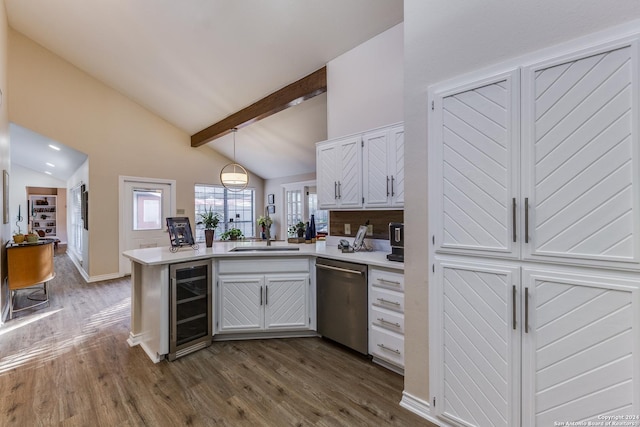 kitchen with vaulted ceiling with beams, beverage cooler, dishwasher, a peninsula, and a sink