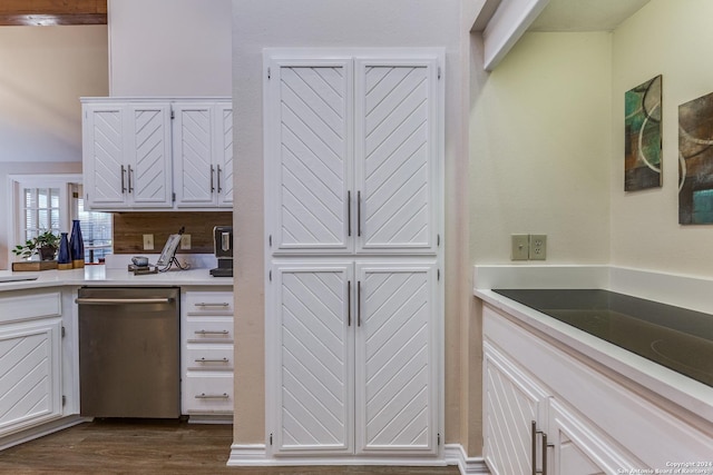 kitchen with dark wood-style floors, dishwasher, white cabinetry, and light countertops