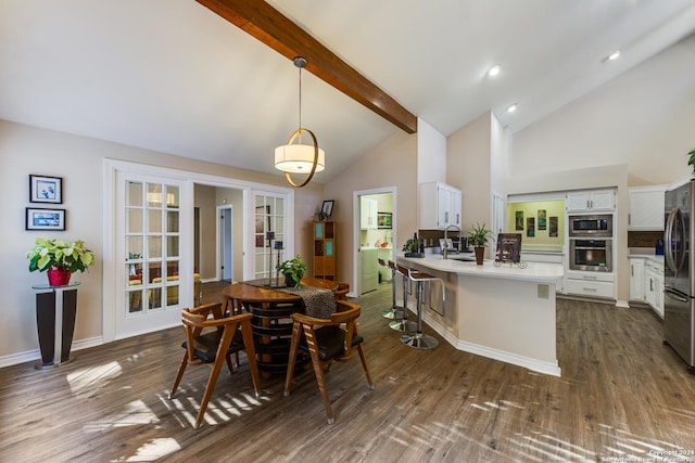 dining room with dark wood-style floors, baseboards, high vaulted ceiling, recessed lighting, and beamed ceiling