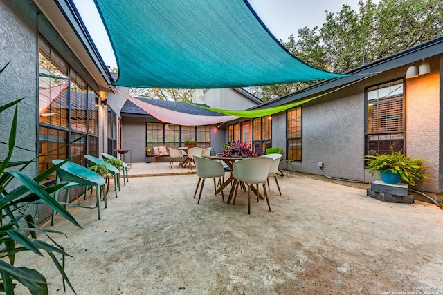 view of patio featuring outdoor dining area