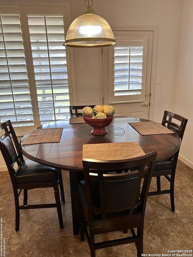 dining space with baseboards