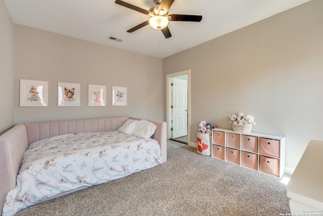 bedroom featuring a ceiling fan, visible vents, and carpet floors