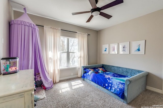 carpeted bedroom featuring a ceiling fan and baseboards