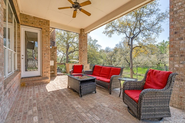 view of patio with ceiling fan, outdoor lounge area, and fence