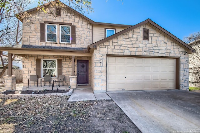 view of front facade featuring stone siding, a porch, driveway, and a garage