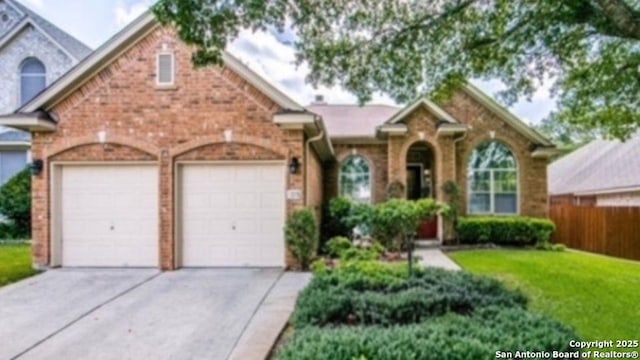 view of front of house featuring a garage, brick siding, concrete driveway, and a front yard