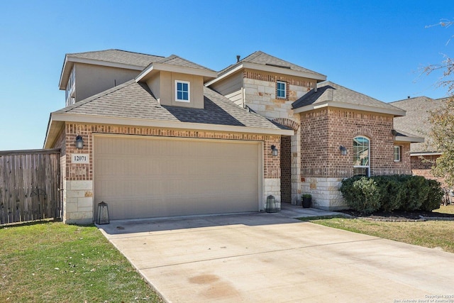 view of front of home with driveway, stone siding, fence, a garage, and brick siding