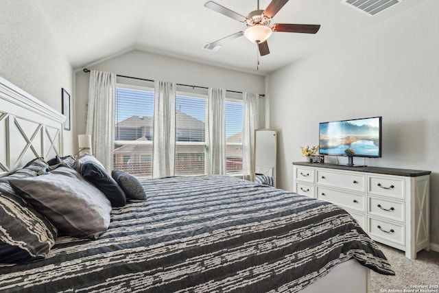 bedroom with visible vents, a ceiling fan, lofted ceiling, and carpet