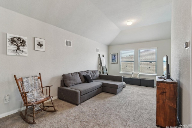 carpeted living room featuring visible vents, lofted ceiling, and baseboards