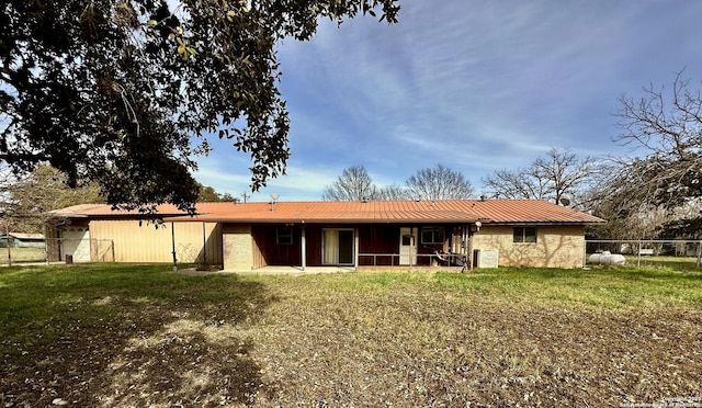 ranch-style house with metal roof