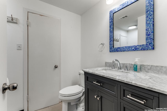 bathroom featuring tile patterned floors, visible vents, toilet, and vanity