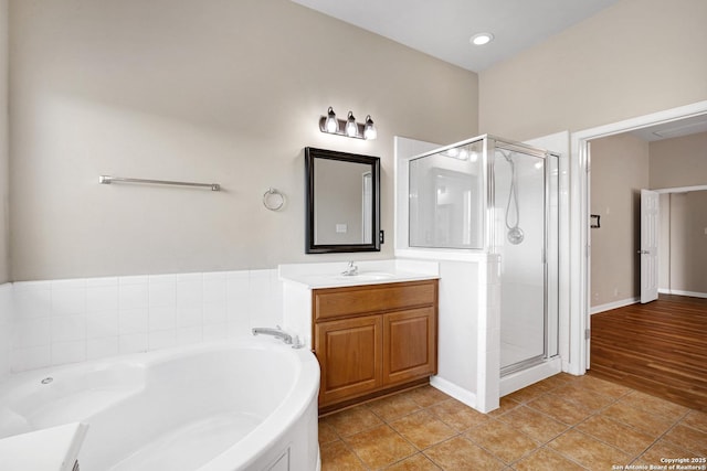 full bathroom with tile patterned floors, vanity, a bath, and a shower stall