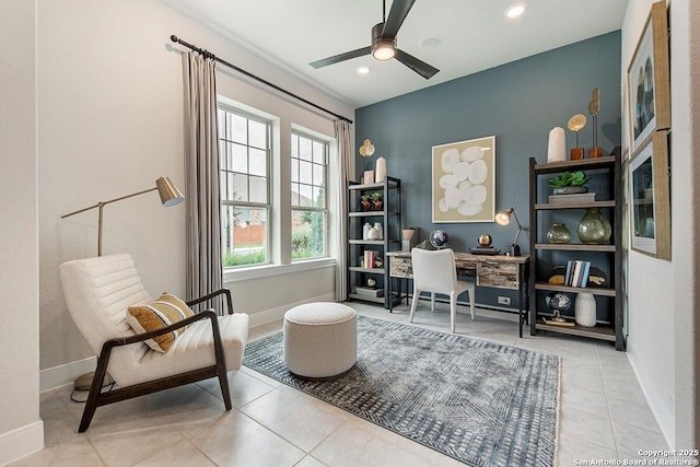 living area featuring tile patterned flooring, recessed lighting, a ceiling fan, and baseboards