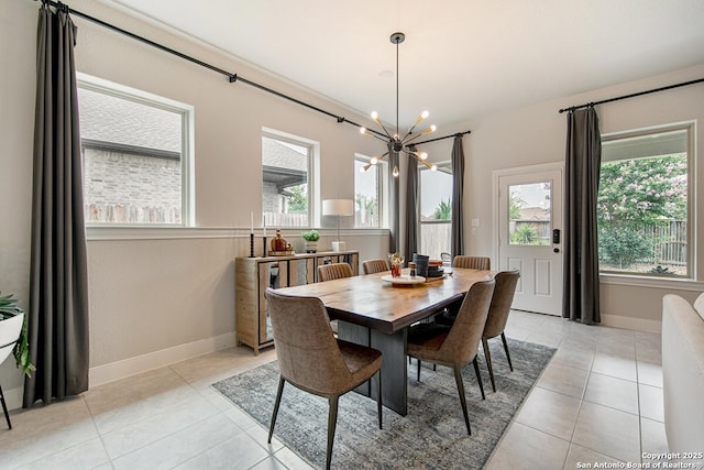 dining room featuring a chandelier, baseboards, and light tile patterned flooring