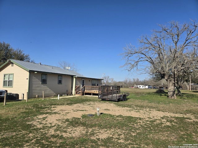 view of yard with a wooden deck